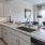 open kitchen counter facing living room with private balcony views