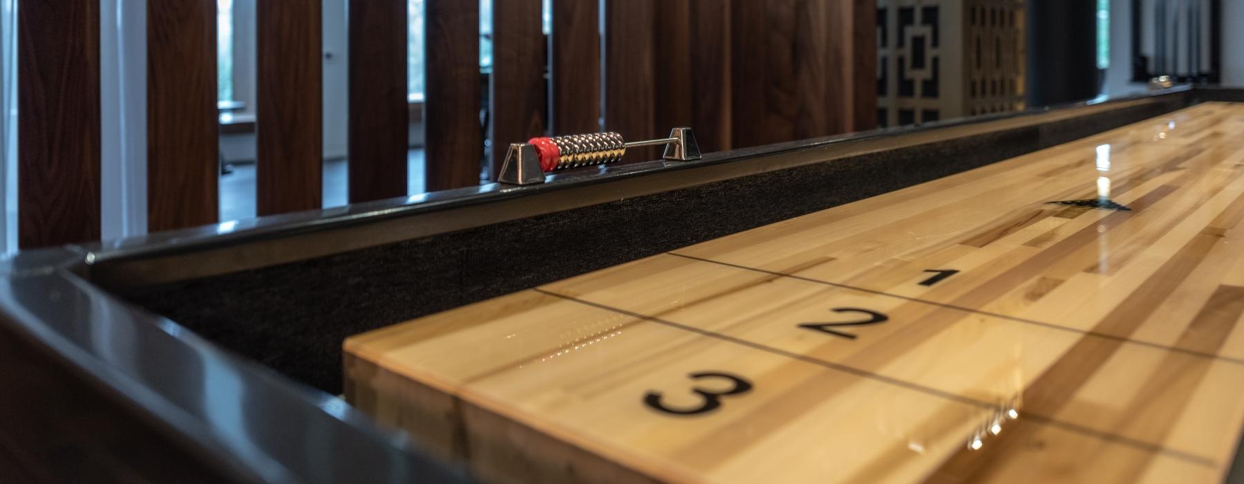 shuffleboard table in resident game room